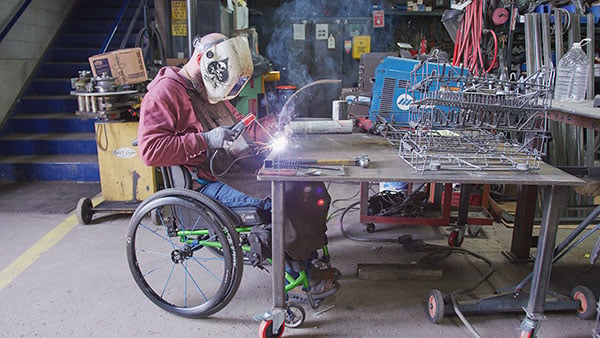 Perrin Nicholson at work welding